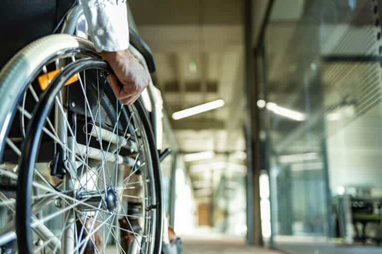 Man with permanent partial disability in a wheelchair.