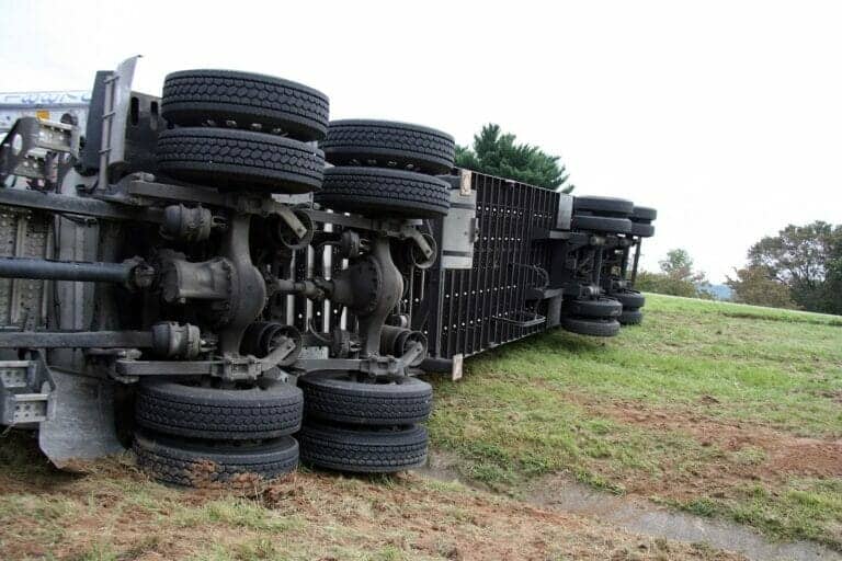 A turned over tractor trailer from an accident that will need a plaintiff to file a truck accident claim for.