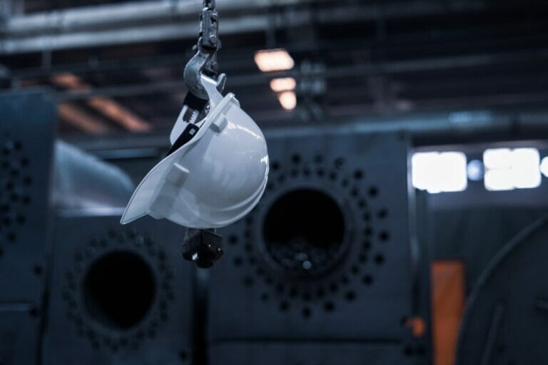 Construction hat hanging in a workspace after a workplace injury
