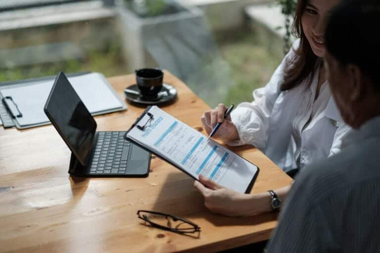 Female presenting his insurance benefits to patient