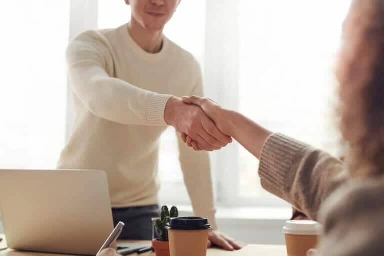 Lawyer shaking clients hand