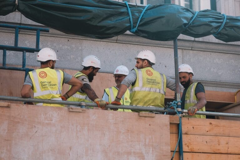 Construction workers talking on a job site