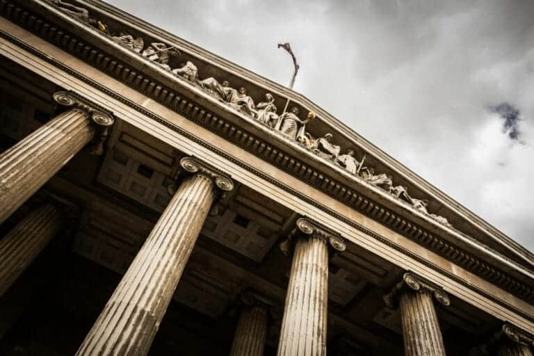 Low angle photography of a beige justice building